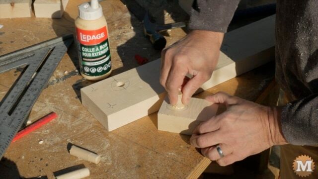 gluing a wooden dowel in the end assembly