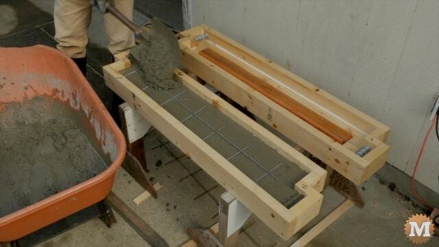 filling the form with wet concrete mix