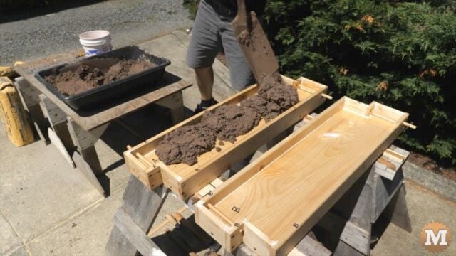 DIY Concrete Garden Bed Easy Form - Shovel wet concrete into form