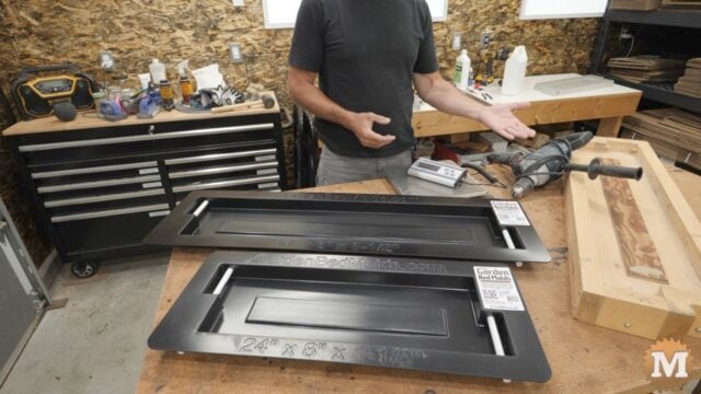 two plastic concrete molds on a workbench